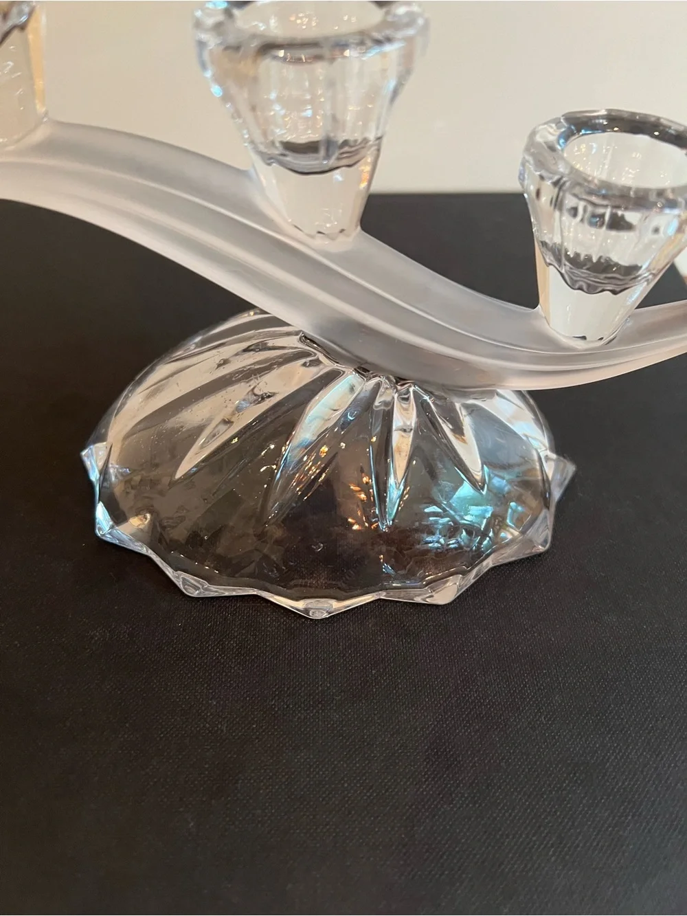 Glass candle holder Features a unique asymmetrical 